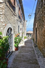 A narrow street among the old stone houses of Castro dei Volsci, a medieval village in the province of Frosinone in Italy.