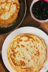 Delicious crepe and blackcurrant jam close up