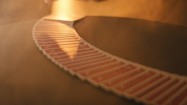 the dealer lays out a deck of cards on the table