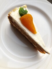 Delicious carrot cake on a white plate
