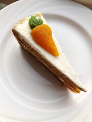 Delicious carrot cake on a white plate