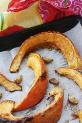 Baked pumpkin with garlic and spices macro 