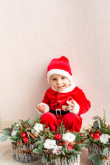 Cute small Santa Claus with Christmas flower decoration.