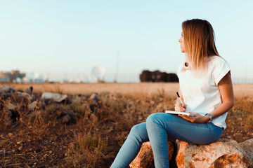 Young woman with her notebook annotated notes of communications