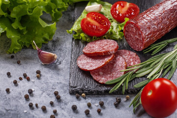 Dry-cured sausage with spices, garlic and herbs  .