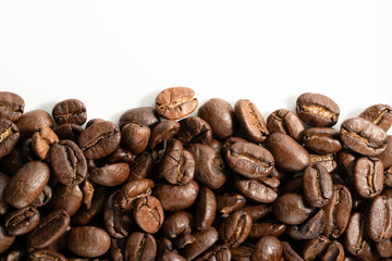 coffee beans close-up on white background with copy space