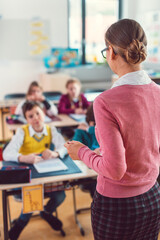 Teacher with her students in class at elementary school