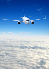 Fototapeta na wymiar Airplane in the sky. Passenger Airliner in clouds.