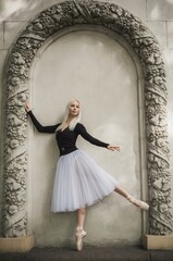 Young ballerina in ballet costume dancing at darkness breath of freedom. Concept of beautiful art dancing 	