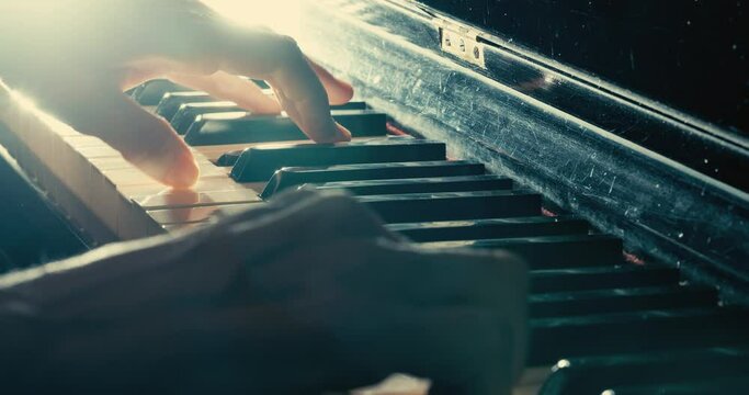 Close-up of hands playing the piano