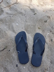 Fototapeta na wymiar sandals and sand 