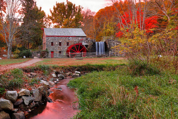 The Wayside Inn Grist Mill with water wheel and cascade water fall in Autumn at sunrise, Concord Massachusetts USA © jayyuan