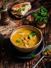 Vegan Sweet Potato Chickpea curry in  bowl on a wooden background.