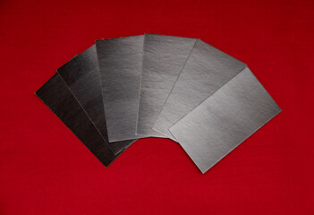 six black cards without inscriptions on a red background