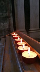 candles in church florence italy pray