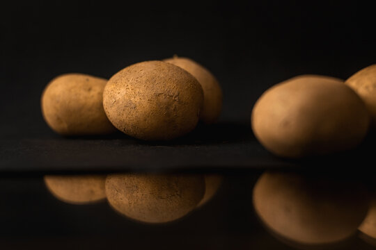 Potatoes on black background