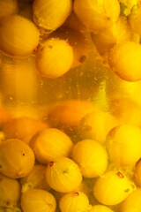 Gooseberry jam / juice / marmelade in the glass jar. Sweet fruity food. 