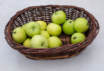 Mullins Yellow Seeding / Yellow Transparent / White Transparent apples in the dark brown wicker basket on white table