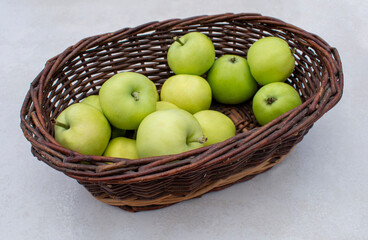 Mullins Yellow Seeding / Yellow Transparent / White Transparent apples in the dark brown wicker basket on white table