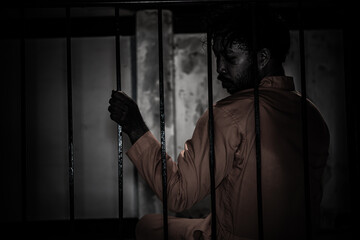 Asian man desperate at the iron prison,prisoner concept,thailand people,Hope to be free,Serious prisoners imprisoned in the prison