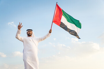 business men wearing traditional uae white kandura spending time in the desert of Dubai