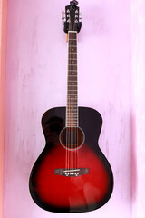 Guitar hanging on wall