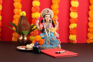 Lakshmi pujan - godess laxmi idol, Copper Kalash, coconut with Red accounting note book and haldi...
