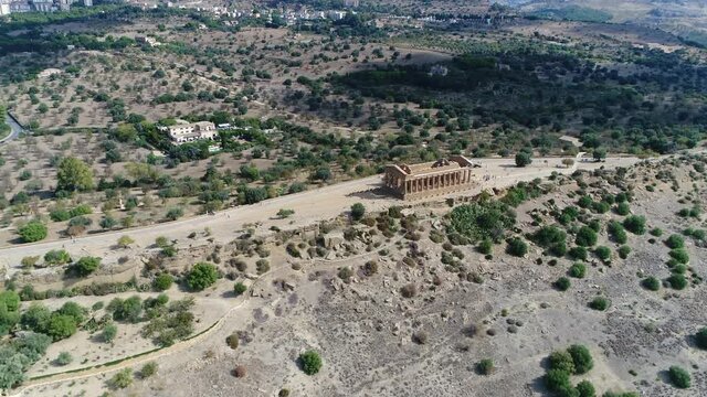 Aerial view of the Temple of Concordia is an ancient Greek building in the Valle dei Templi in Agrigento at the south coast of Sicily Italy it is the one of best preserved temples in general 4k
