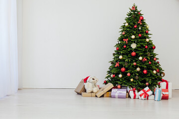 Fototapeta premium Christmas tree pine with gifts for the new year decor background place for inscription