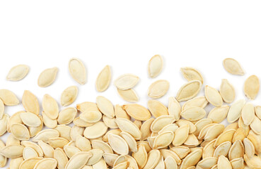 Pumpkin seeds on a white background, isolated. Top view, pumpkin seeds background