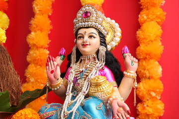 Obraz na płótnie Canvas Idol worshipping of Hindu Goddess Lakshmi - Lakshmi Puja is a Hindu religious festival