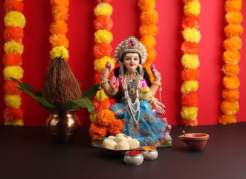 Lakshmi pujan - godess laxmi idol, Copper Kalash, coconut, saweets and haldi kumkum