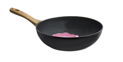 frying pan with raw meat on isolated background