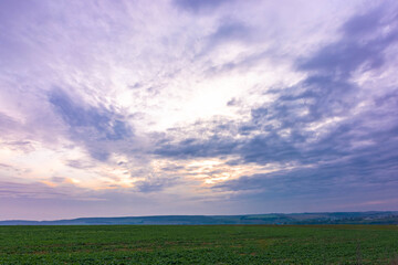 Clouds at sunset. Rural landscape.