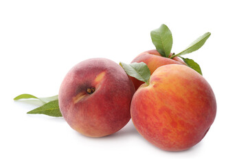 Delicious ripe juicy peaches with leaves isolated on white