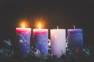 advent decoration with two burning candles - 388094222