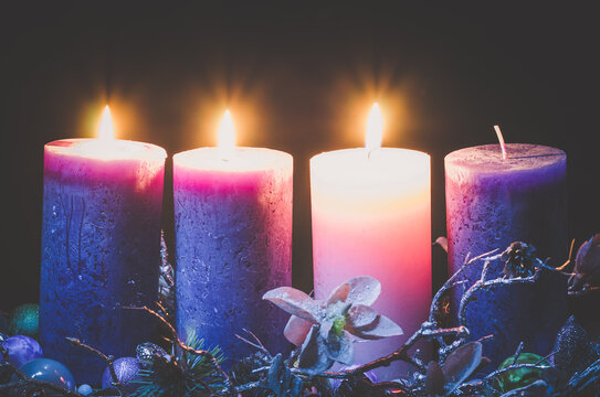 advent decoration with three burning candles