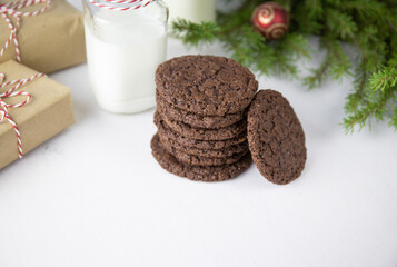 Chocolate Chip Cookies on a White Plate with Milk Bottles. Christmas concept