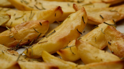 baked potatoes with rosemary close up