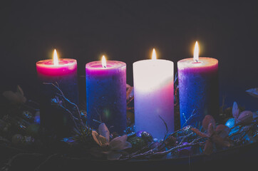 four  advent candles burning on black background - 388095663