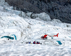 Photos of a group of travelers waiting for helicopter during ice climbing activities at Fox Glacier of New Zealand © Shirley Chen