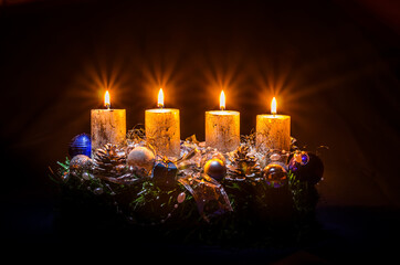 golden advent candles burning religious concept