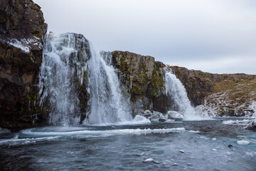 Iconic waterfall named Kirkjufellsfoss in Iceland