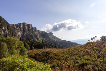 Fototapeta na wymiar Autumn mountains, a place for nature lovers and tourists on a Sunny day in the bosom of nature.