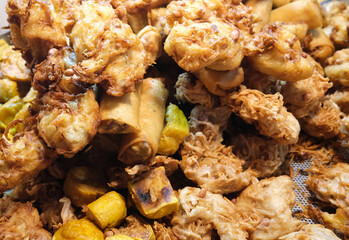 focus on Fried vegetarian spring rolls, Crispy deep-fried Taro, and Fried tofu