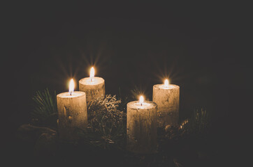 four burning candles on advent wreath - 388096828