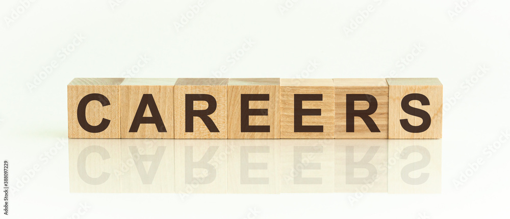 Poster wooden blocks with the text: careers. the text is written in black letters and is reflected in the m