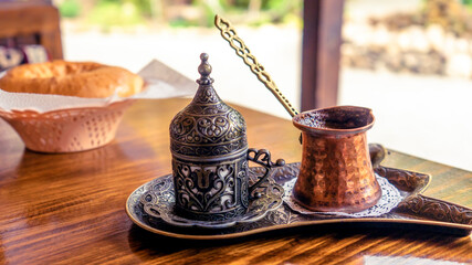 Turkish coffee with traditional embossed metal tray and cup