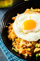 Spicy fried rice with chicken, kimchi and egg