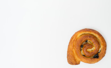 Fototapeta premium Sweet cinnamon bun roll swirl isolated over the white background